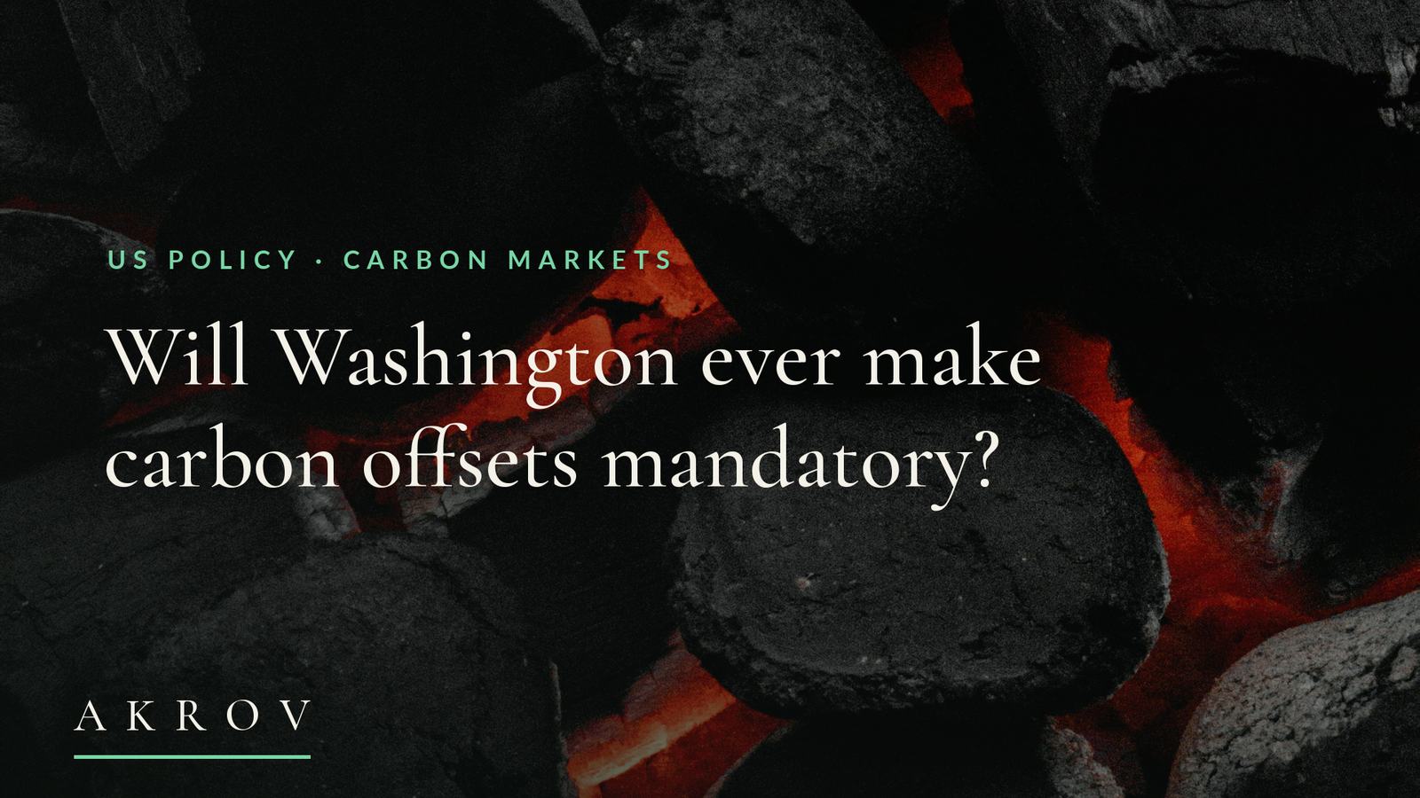 Burning coals glowing red beneath charred black briquettes